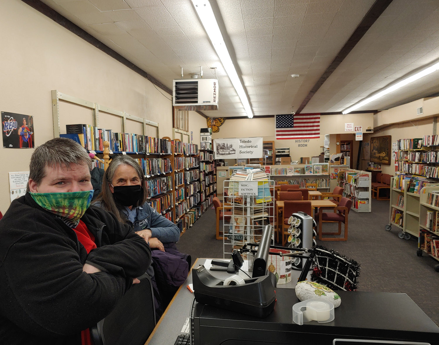Volunteers Charlie Pruitt and Pat Caldwell staff the Toledo Community Library in this file photo.